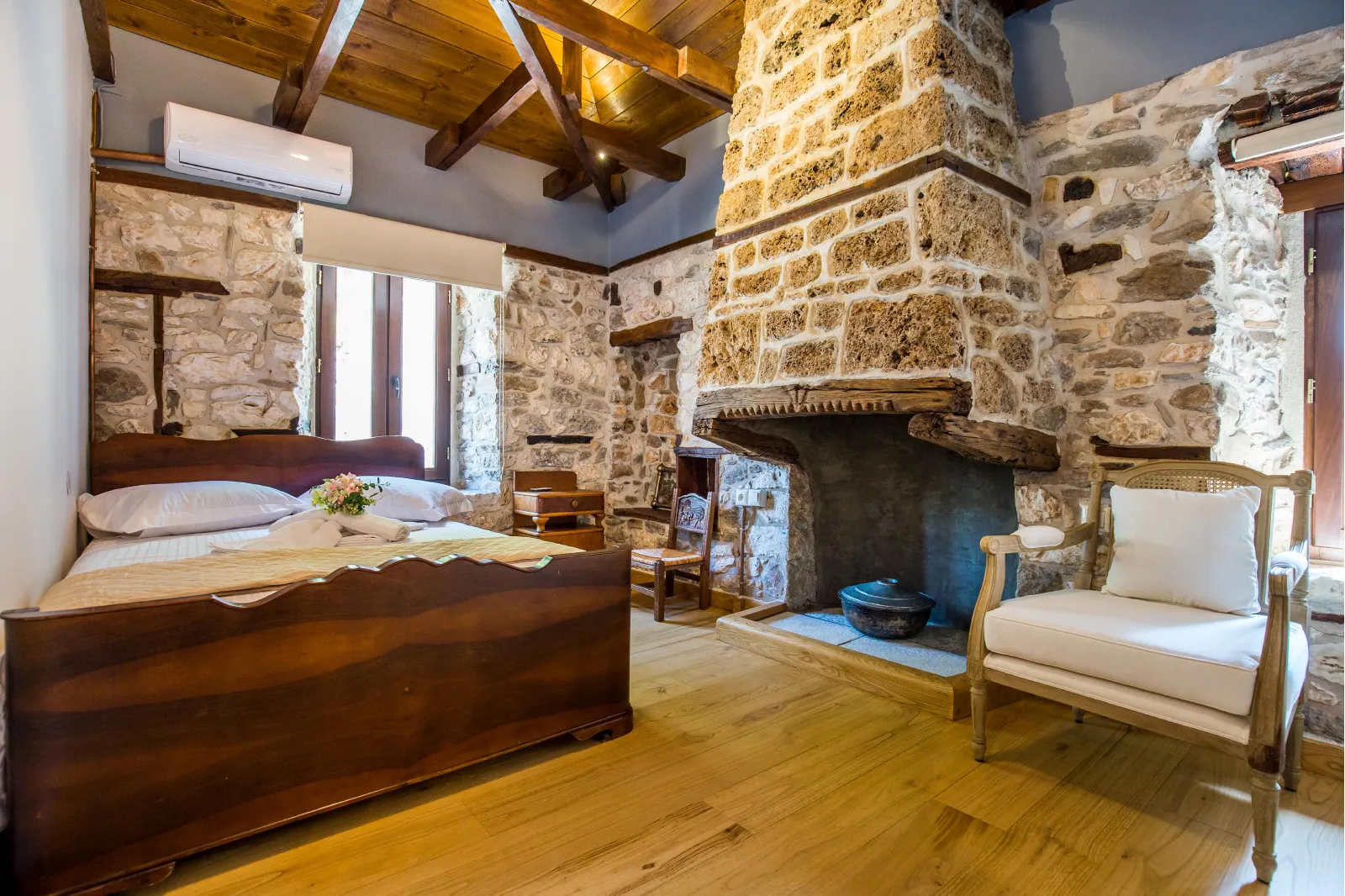 Bedroom and restored interior 14 at Maroyda Stonehouse in Panagia, Thassos